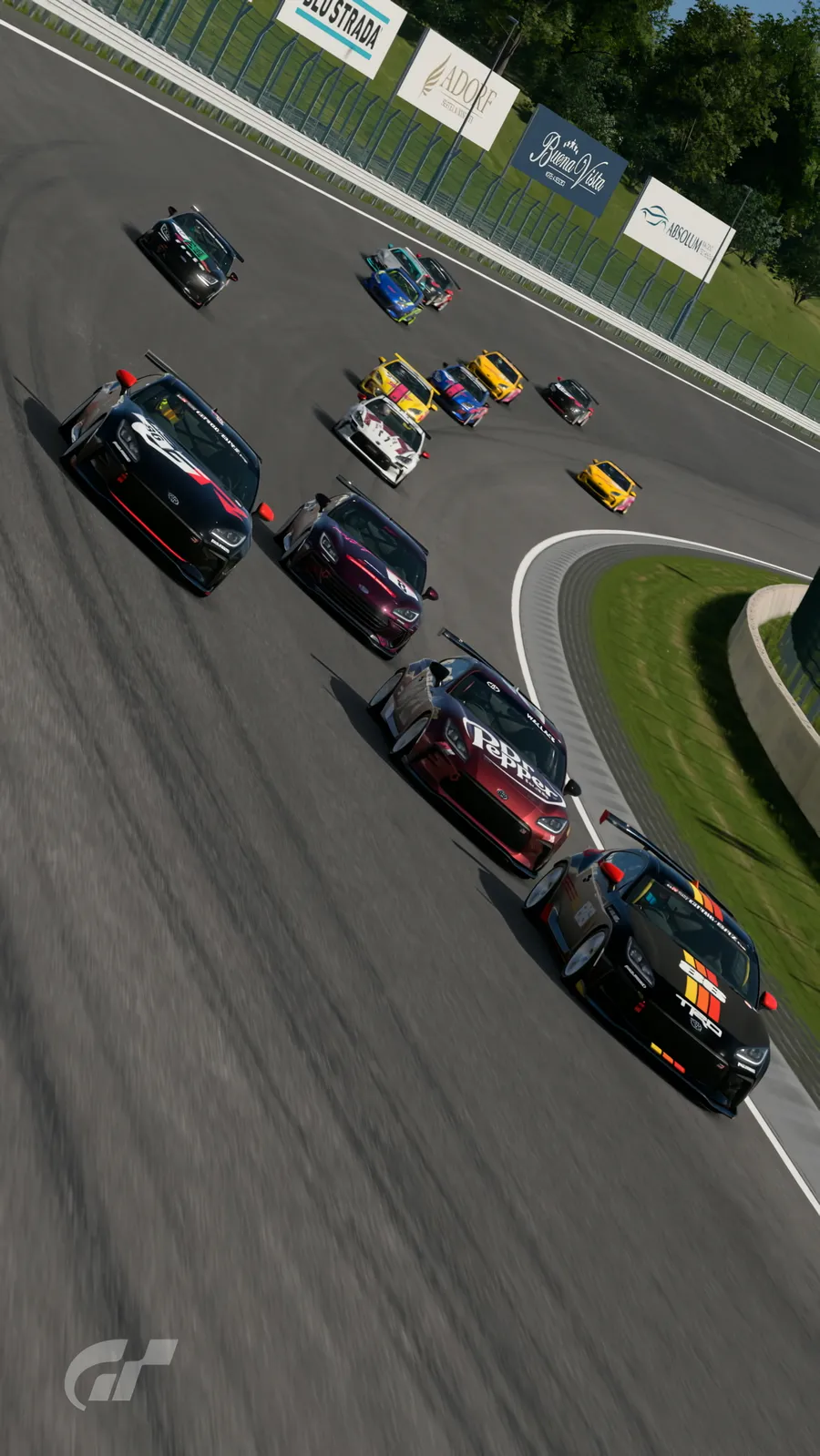 A full grid of liveried BRZ and GR86 race cars streaming through a corner
