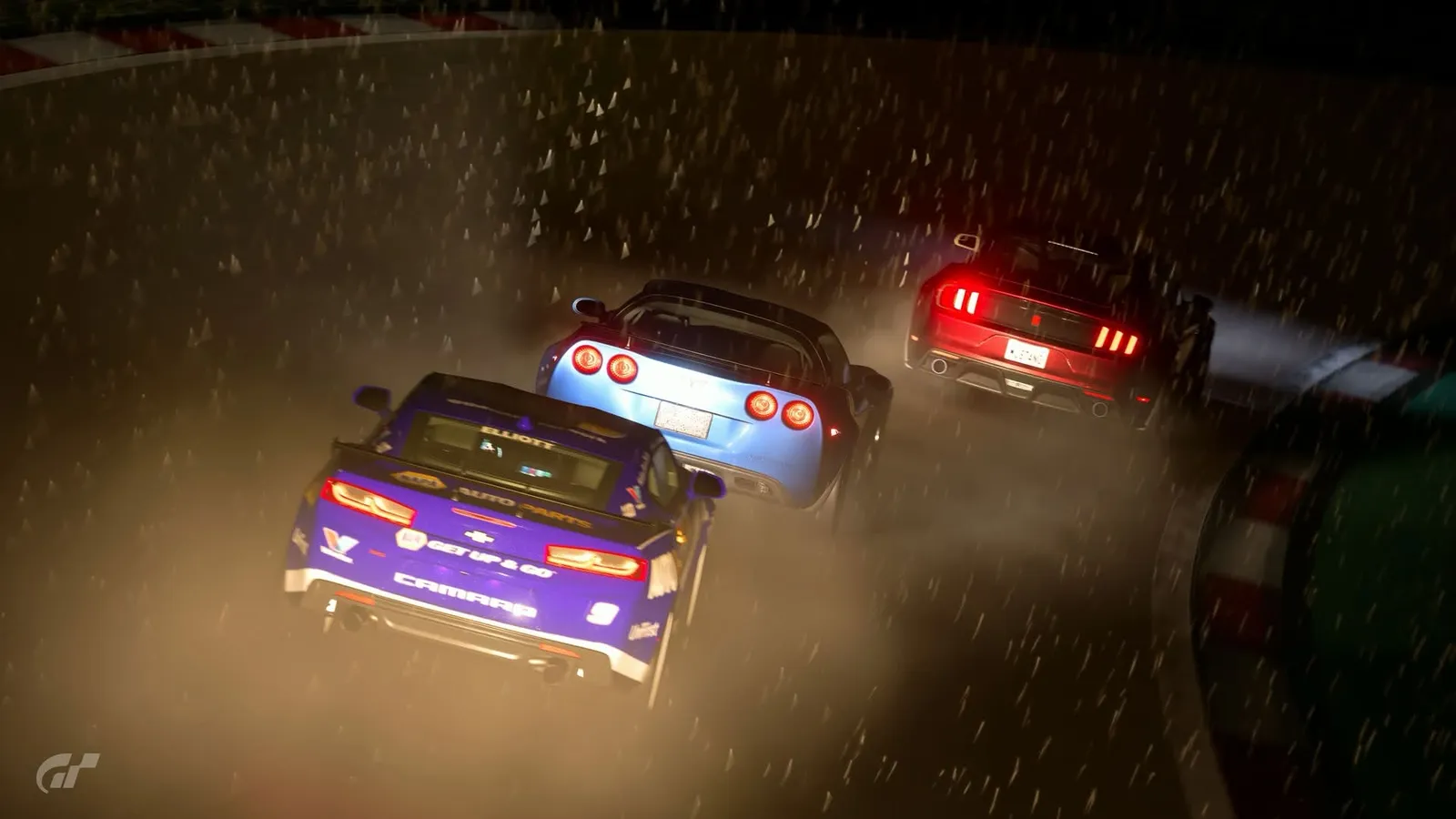 Three cars racing nose to tail through heavy rain at night, tail lights glowing in the spray